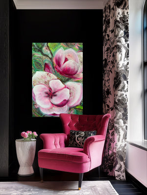 Pink armchair in a room with floral artwork and decorative elements.