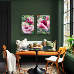 Modern interior with a green wall, floral artwork, and a seating area with a table and chairs.