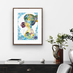 Colorful abstract art print on a wall above a desk with decorative items.
