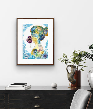 Colorful abstract art print on a wall above a desk with decorative items.