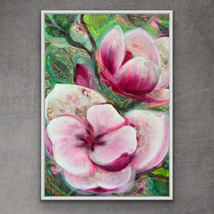 Framed artwork of pink flowers on a gray wall