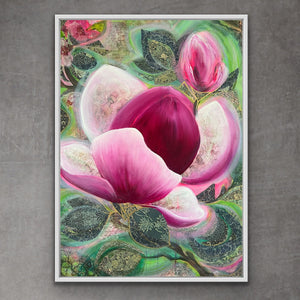 Framed magnolia artwork of pink flowers with green and gold patterns on a gray wall.