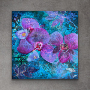A square mixed-media painting of purple orchids and blue leaves on a textured teal background, displayed on a gray concrete wall.