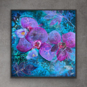 A framed square canvas art print featuring a vibrant purple orchid painting on a textured blue background, mounted on a gray concrete wall.