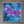 A square framed floral painting featuring large purple orchid-like blossoms over a vivid blue and teal textured background, displayed against a gray wall.