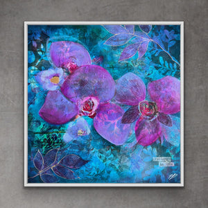 A square framed floral painting featuring large purple orchid-like blossoms over a vivid blue and teal textured background, displayed against a gray wall.