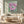 Pink abstract floral canvas print Where Love Is by Edita Fields displayed in an elegant modern living room.