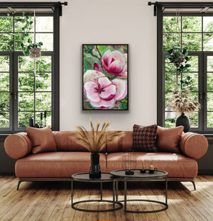 Living room with a brown leather sofa, coffee table, and floral artwork on the wall.