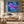 Large abstract purple and blue floral wall art  in the living room. Print on canvas in a natural floating frame. 