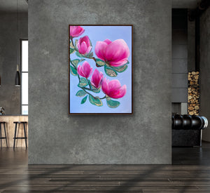 Luxury magnolia canvas print with pink flowers displayed on a textured concrete wall in a modern minimalist interior with natural light