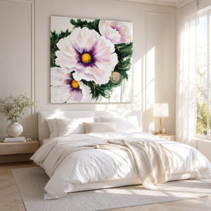 Decorative floral painting above a bed in a bright bedroom
