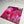 A matted art print featuring a vibrant abstract botanical design in shades of magenta, pink, and red, displayed on a glossy white surface with paintbrushes in the background.